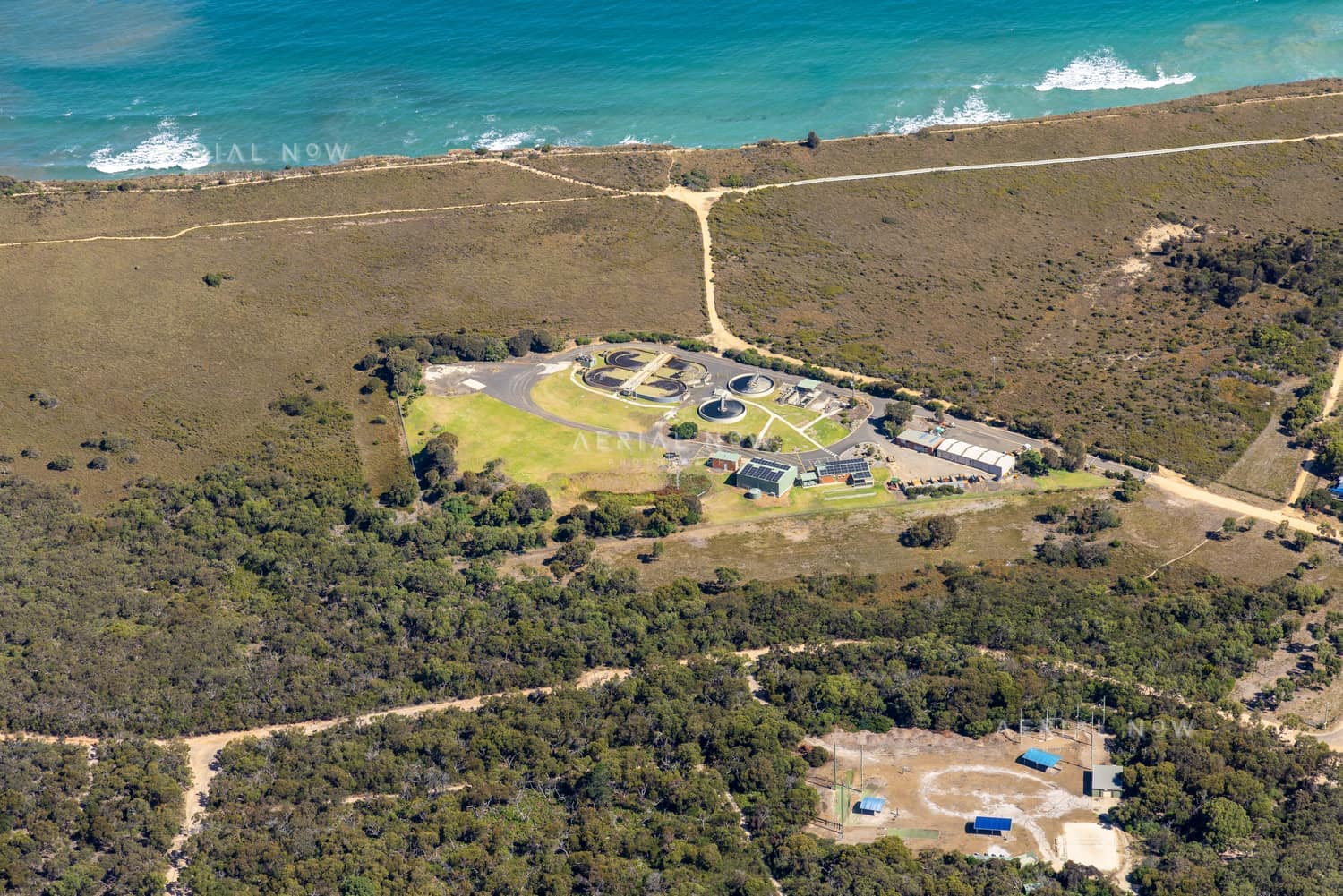 Aerial view of Anglesea Water Reclamation Plant near the coastline and coastal scrub at Anglesea, Victoria.