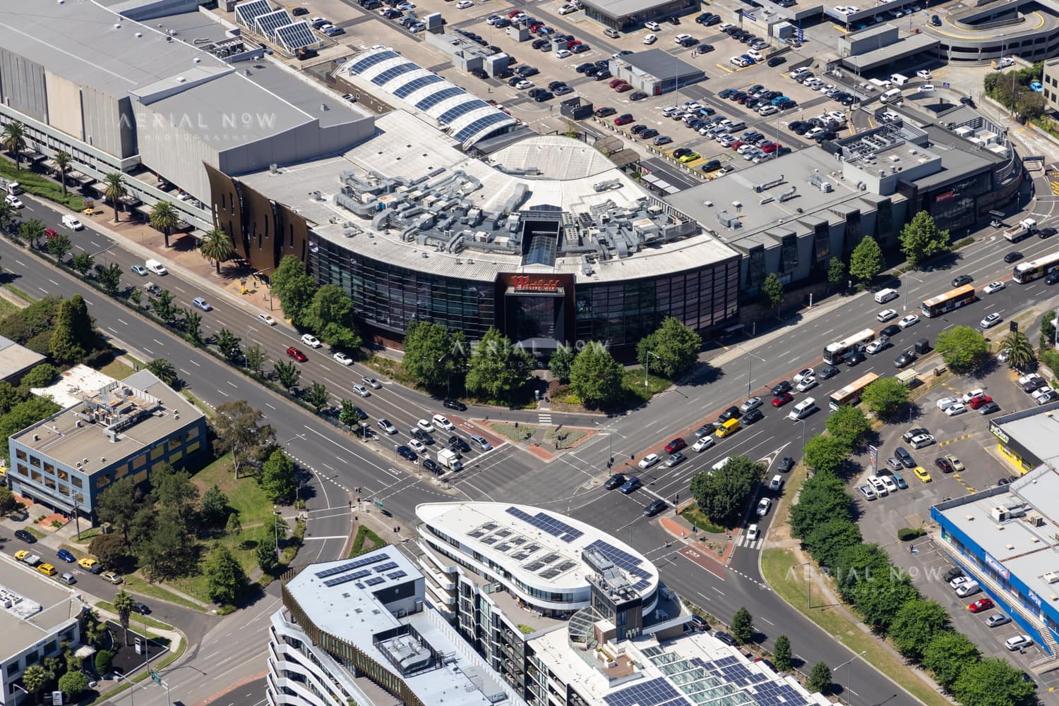 Aerial view of Westfield Doncaster at the intersection of Doncaster Road and Williamsons Road in Doncaster VIC, with traffic, car parks and surrounding commercial buildings visible.