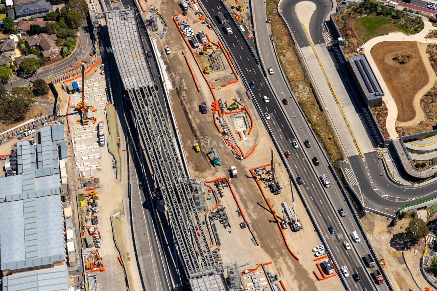 Aerial view of Eastern Freeway construction works in Balwyn North, with traffic, heavy machinery, work zones and nearby streets visible.