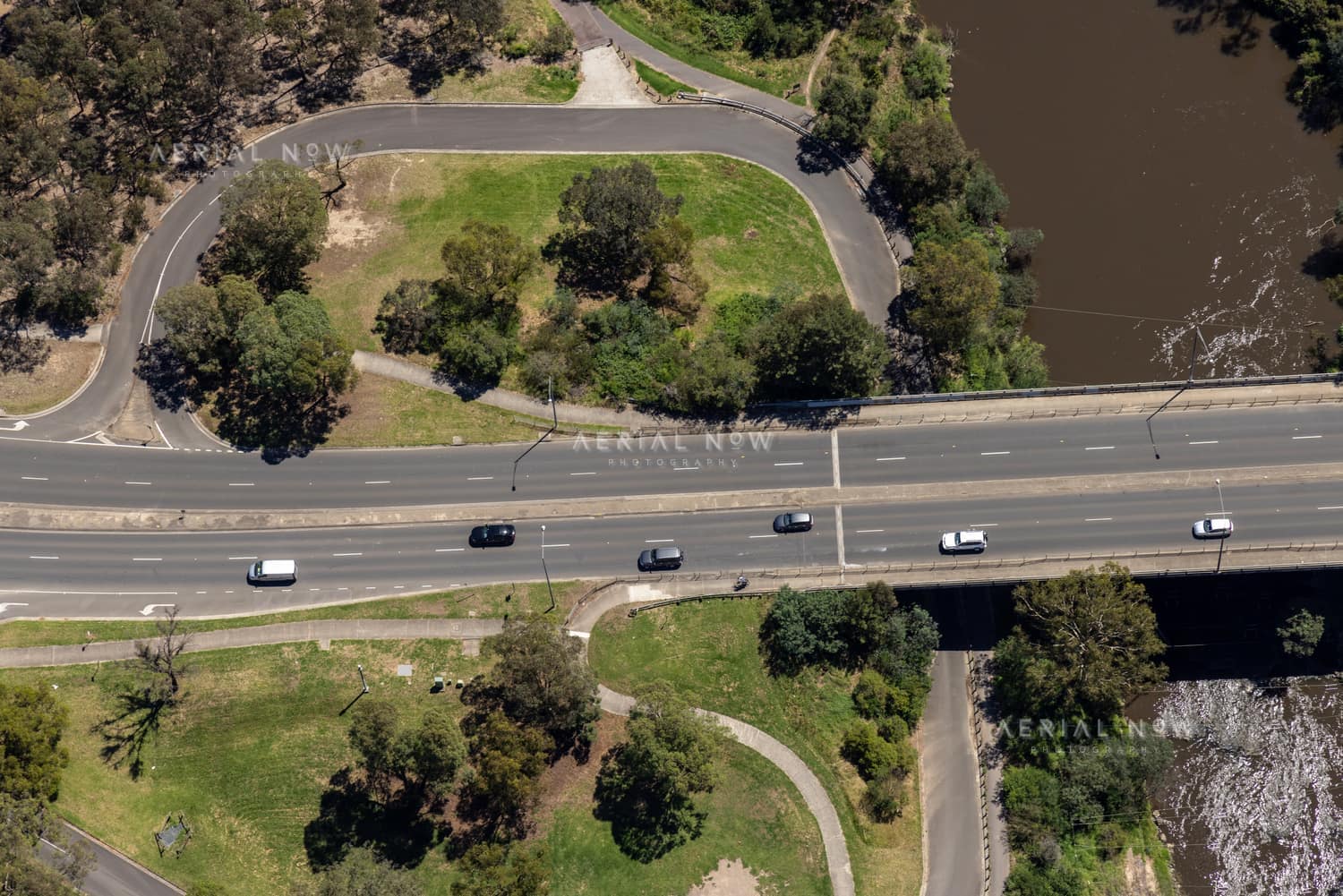 Aerial view of Fitzsimons Lane Bridge with the Yarra River in view and traffic passing over the bridge in Templestowe, Victoria.