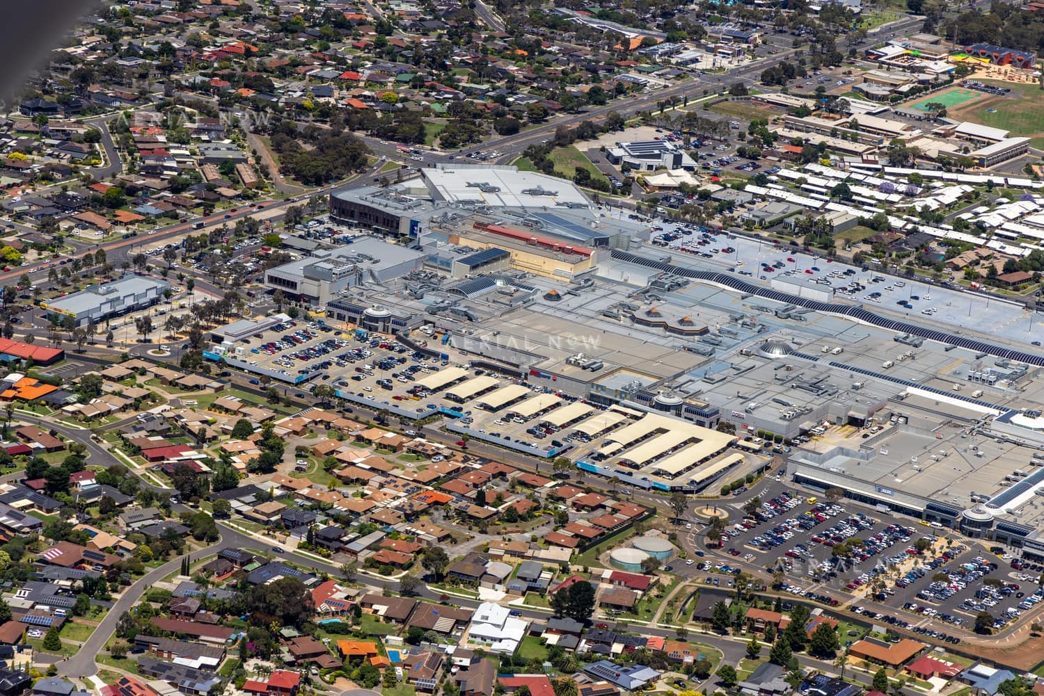 Aerial view of Pacific Werribee shopping centre in Werribee, VIC, showing the large retail complex, car parks, surrounding roads and nearby residential streets.