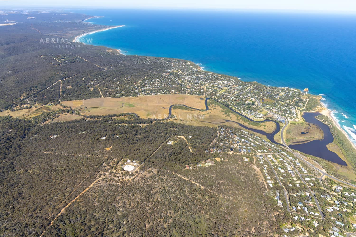 Aerial view of Painkalac Creek, Split Point Lighthouse and the surrounding Aireys Inlet and Fairhaven coastline in Victoria.