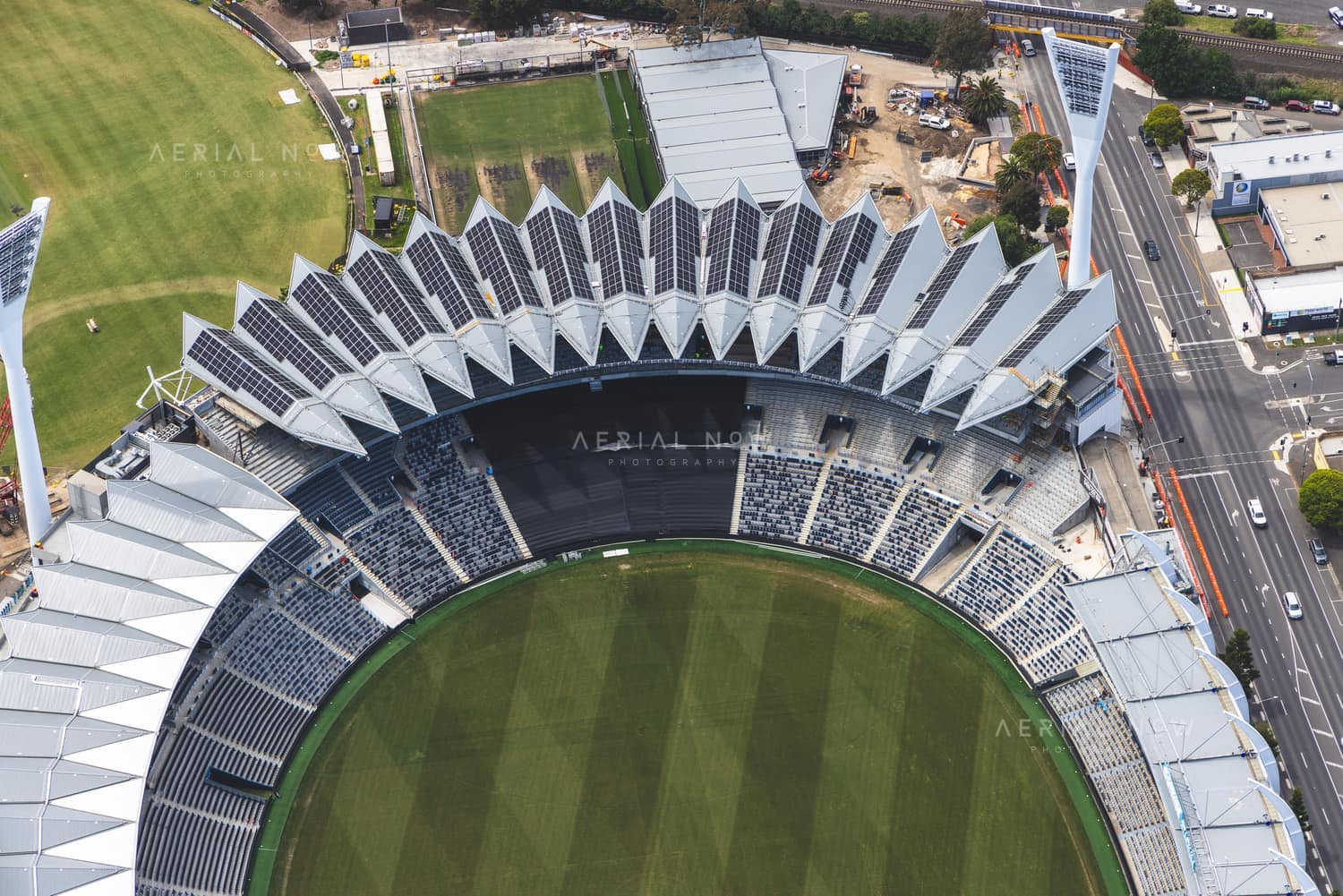 Aerial view of GMHBA Stadium at Kardinia Park in South Geelong, showing the oval, grandstands, light towers, Moorabool Street and surrounding facilities.