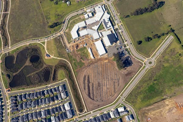Aerial view of Clyde Secondary College with Stage 2 expansion works, hardcourts and the prepared sports-oval area in Clyde, Victoria.
