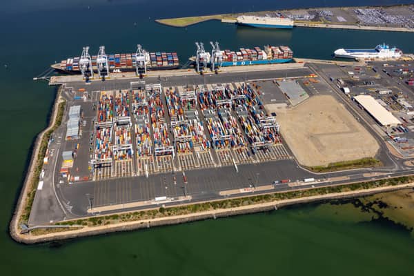 Aerial view of container ships, ship-to-shore cranes and container stacks at Webb Dock East, Port Melbourne, in February 2022.