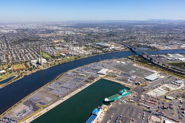 Aerial view of Webb Dock West vehicle-storage areas, roll-on roll-off berths, the Yarra River and West Gate Bridge at Port Melbourne in February 2022.