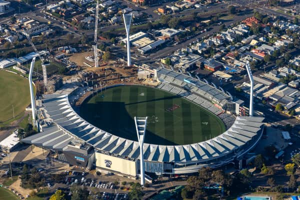 Aerial view of GMHBA Stadium at Kardinia Park in South Geelong VIC, showing the oval, grandstands, light towers, surrounding streets and nearby construction works.