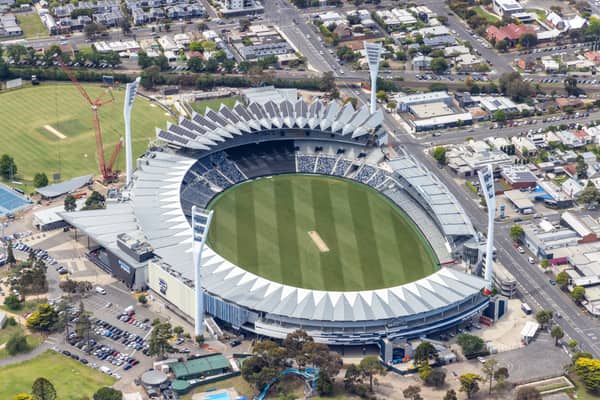 Aerial view of GMHBA Stadium at Kardinia Park in South Geelong, with the oval, grandstands, light towers, surrounding streets and nearby urban blocks visible.