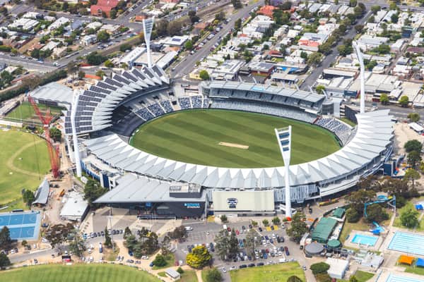 Aerial view of GMHBA Stadium at Kardinia Park in South Geelong, showing the oval, grandstands, light towers, car parking and surrounding streets.