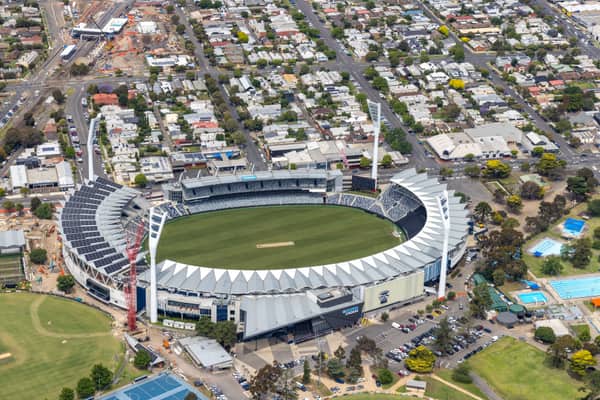 Aerial view of GMHBA Stadium within Kardinia Park in South Geelong, with grandstands, the oval, surrounding car parks, sports fields and residential streets visible.