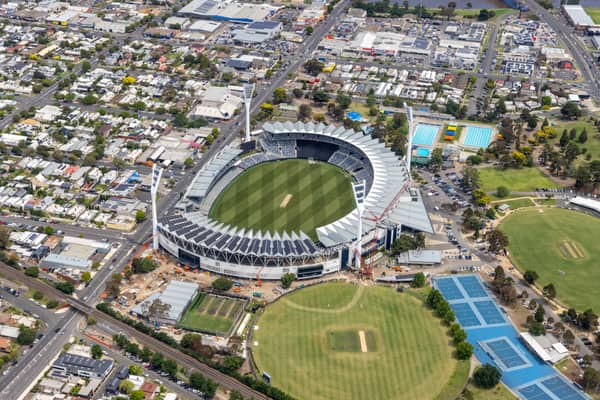 Aerial view of GMHBA Stadium in Kardinia Park, South Geelong, showing the oval, grandstands, nearby cricket grounds, tennis courts, car parks and surrounding streets.