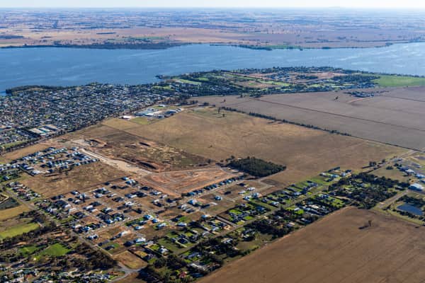 Aerial view of residential subdivision works and lakeside housing beside Lake Mulwala in Yarrawonga, Victoria.