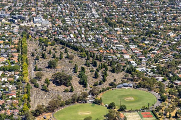 Aerial view of Boroondara General Cemetery in Kew, with surrounding residential streets, sports ovals and tennis courts visible nearby.