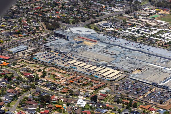 Aerial view of Pacific Werribee shopping centre in Werribee, VIC, showing the large retail complex, car parks, surrounding roads and nearby residential streets.