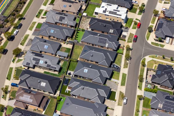 Aerial view of modern residential homes, streets and backyards around Light Horse Circuit in Sunbury, Victoria.