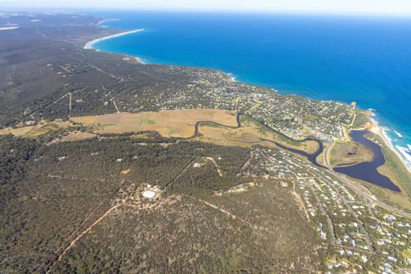Aerial view of Painkalac Creek, Split Point Lighthouse and the surrounding Aireys Inlet and Fairhaven coastline in Victoria.