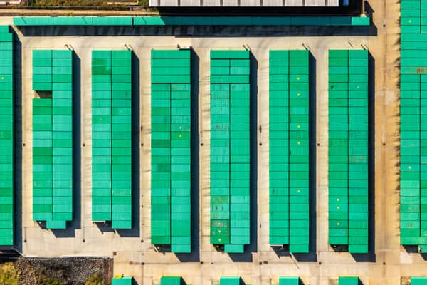 Aerial view of rows of green-roofed storage units and concrete driveways in Harristown, Toowoomba, Queensland.